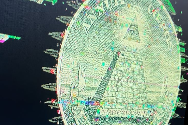 The eye and unfinished pyramid from the back of a dollar bill, glowing pale green on a dark screen and breaking into spikes of colored noise at its edges